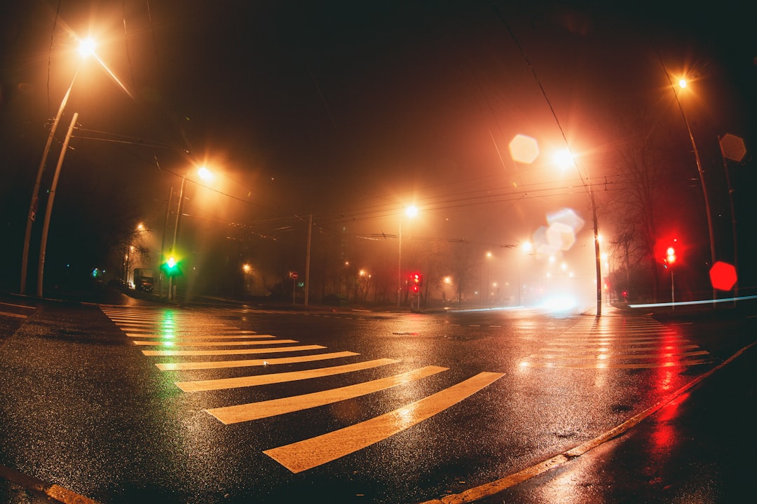 asphalt road with post light during night time photo – Free Asphalt ...