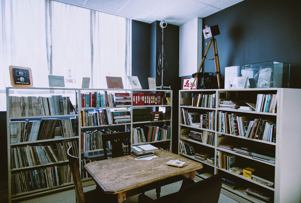 white wooden book shelf in library