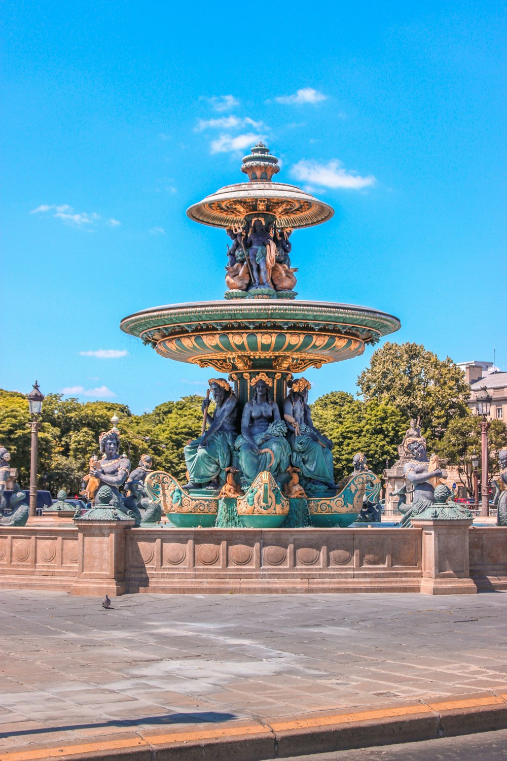 a fountain with statues of people on it