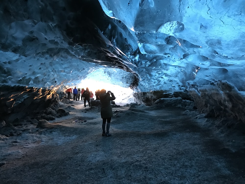 people inside lighted cave