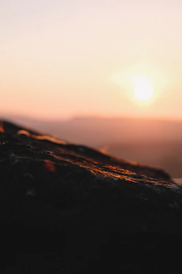 A serene landscape photograph with soft natural lighting at sunset.