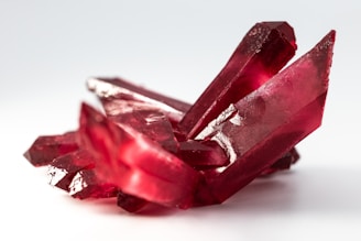 selective focus photo of red gemstone