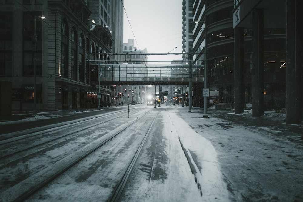 gray empty road across building bridge