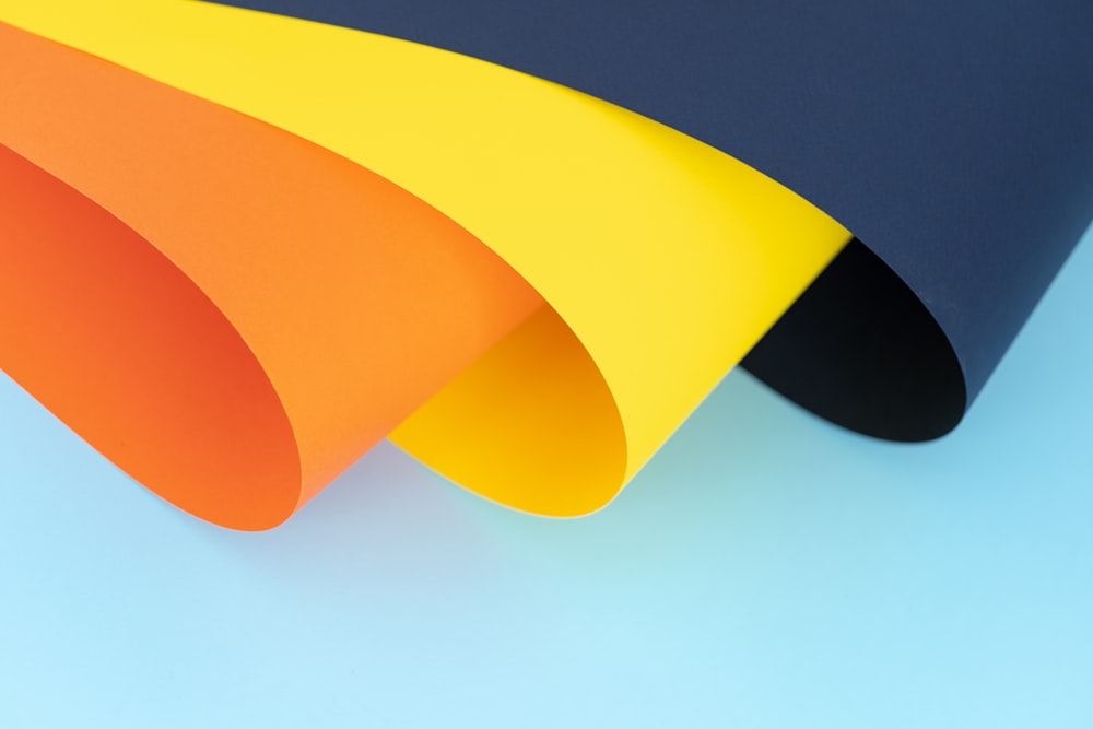 orange, yellow and blue papers