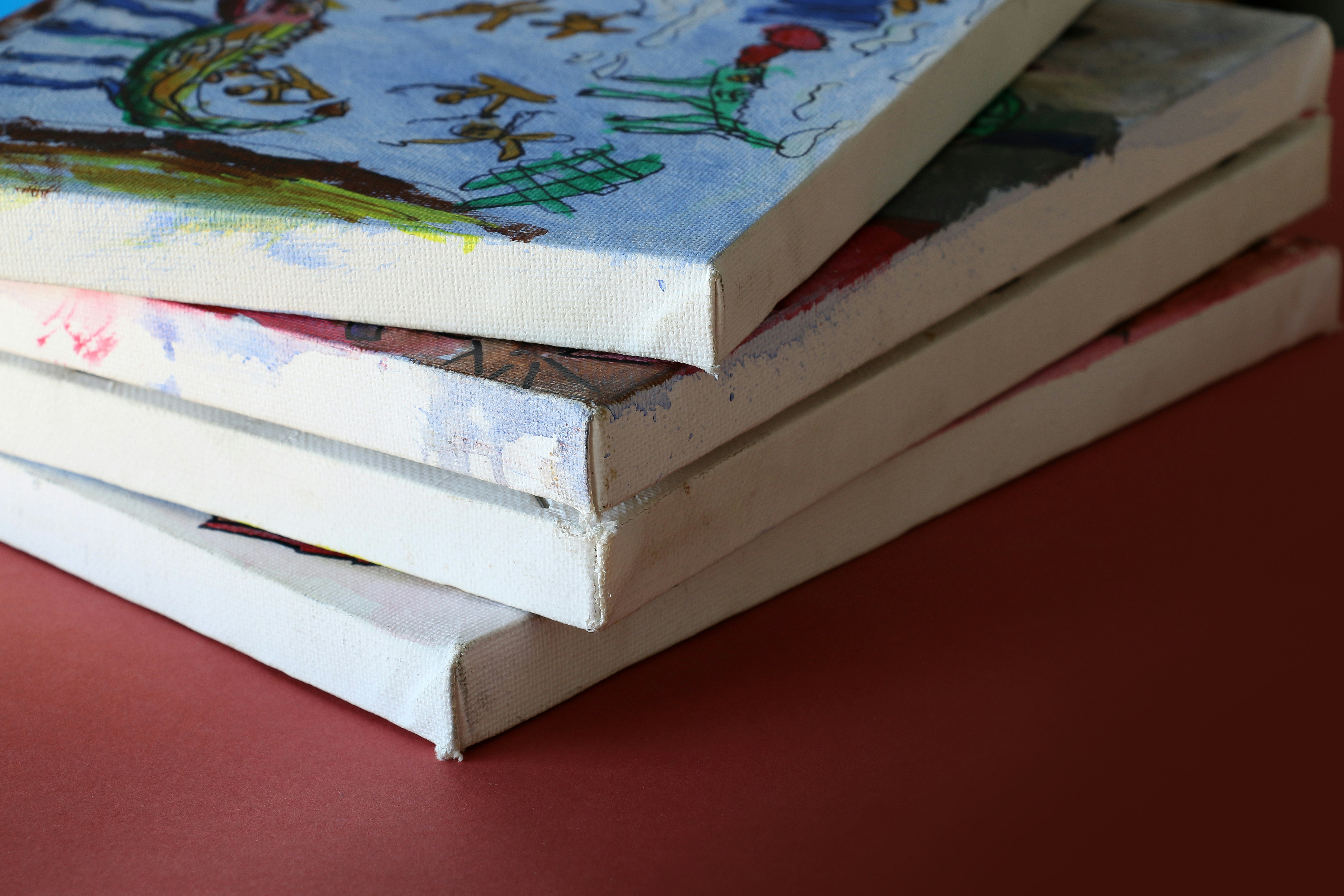 Four assorted paintings of handcrafted flipbook pages