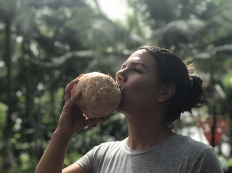 woman drinking coconut juice