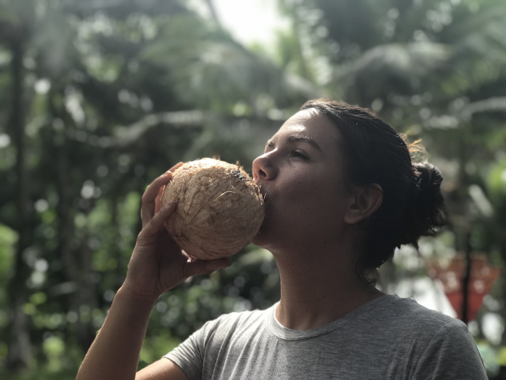 woman drinking coconut juice