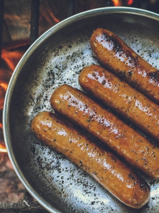 cooked sausage on round grey pan