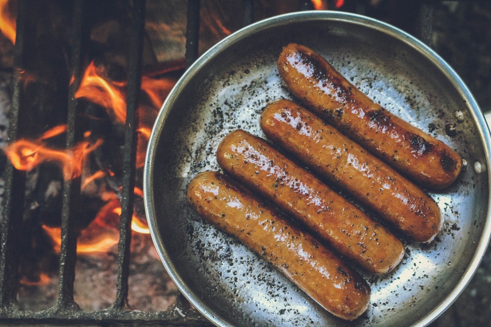 cooked sausage on round grey pan