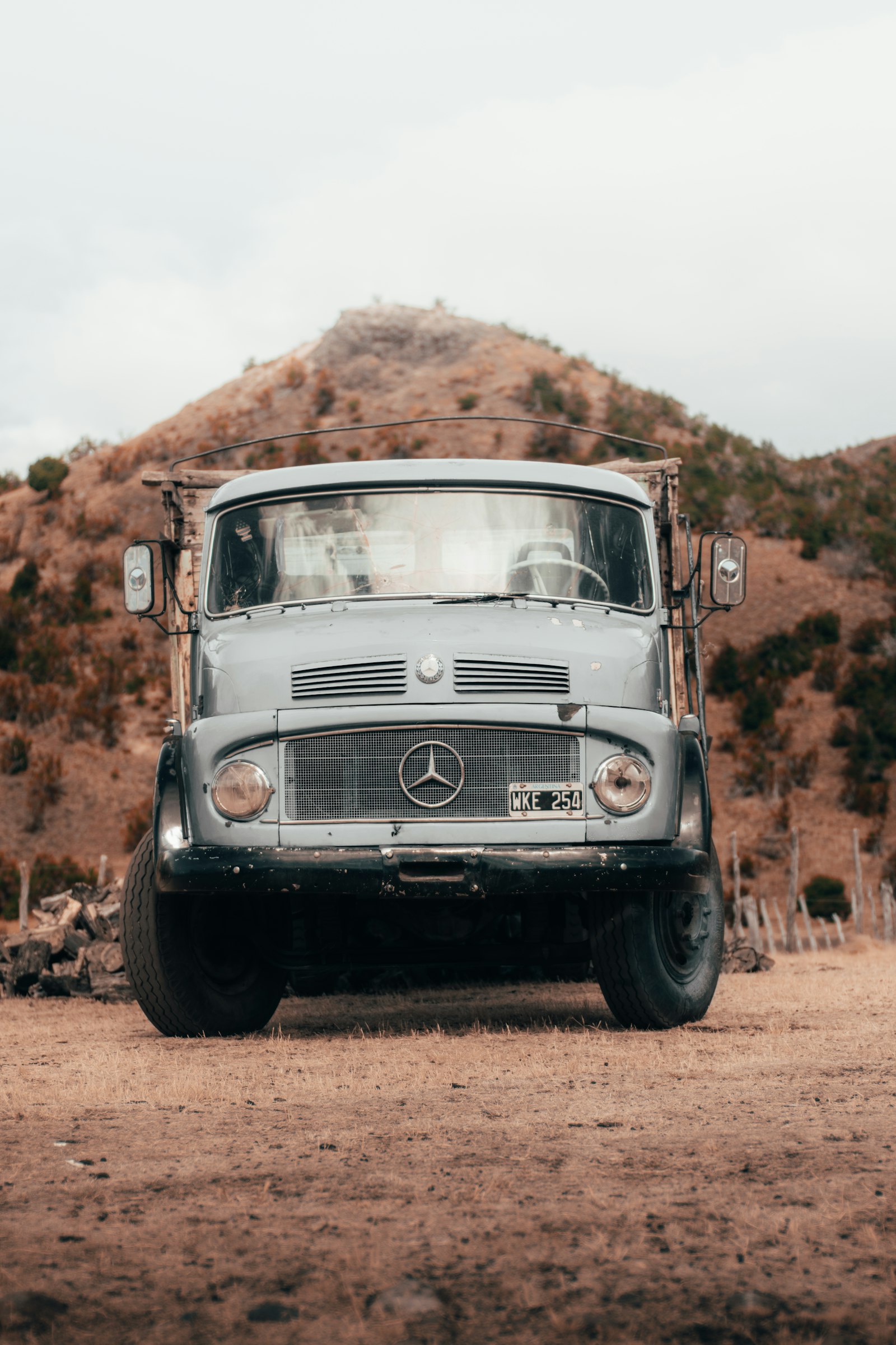 Nikon D5300 + Nikon AF Nikkor 50mm F1.8D sample photo. Parked gray mercedes-benz truck photography