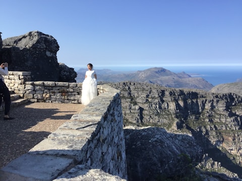 A glamorous photoshoot in a scenic mountain location.