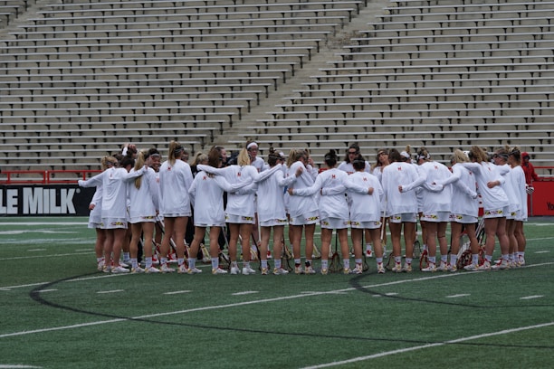 A team huddle of the American River College women's lacrosse players.