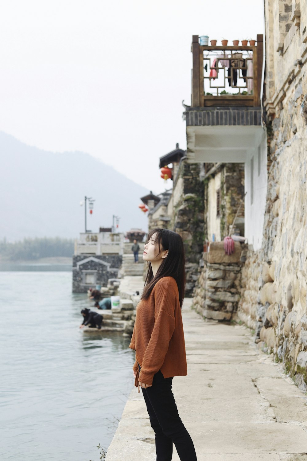 woman wearing orange jacket