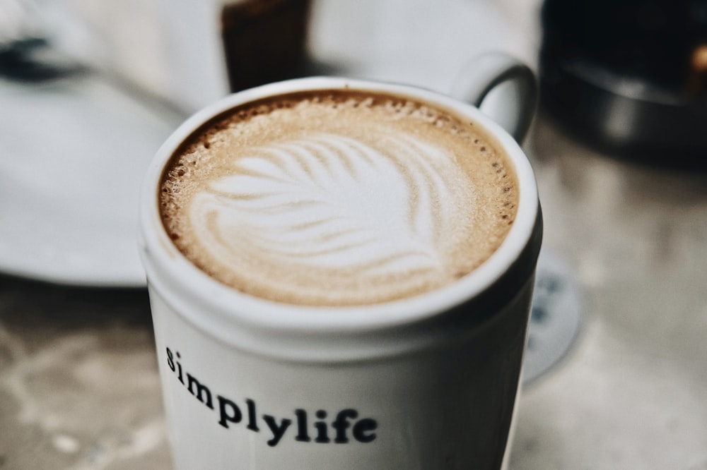 mug of coffee on white surface