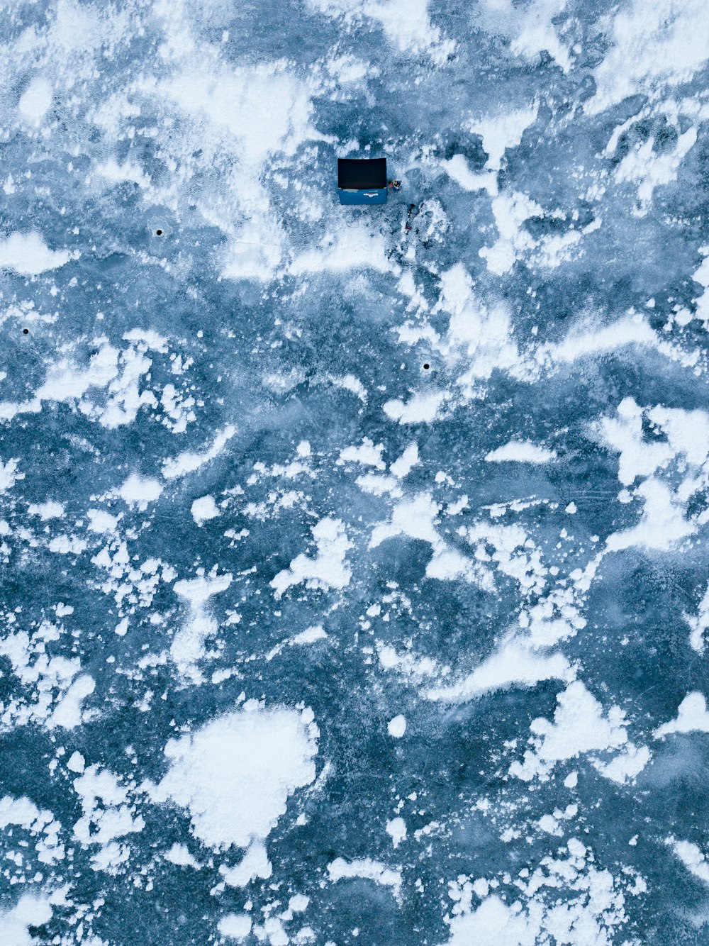 a square object floating on top of a body of water