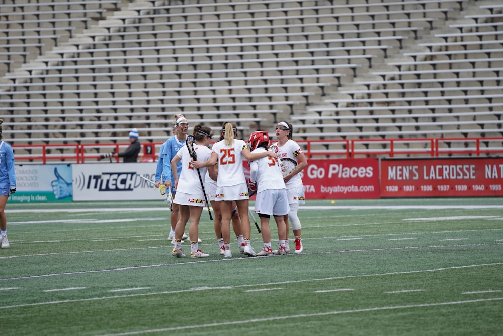 women playing lacrosse during daytime