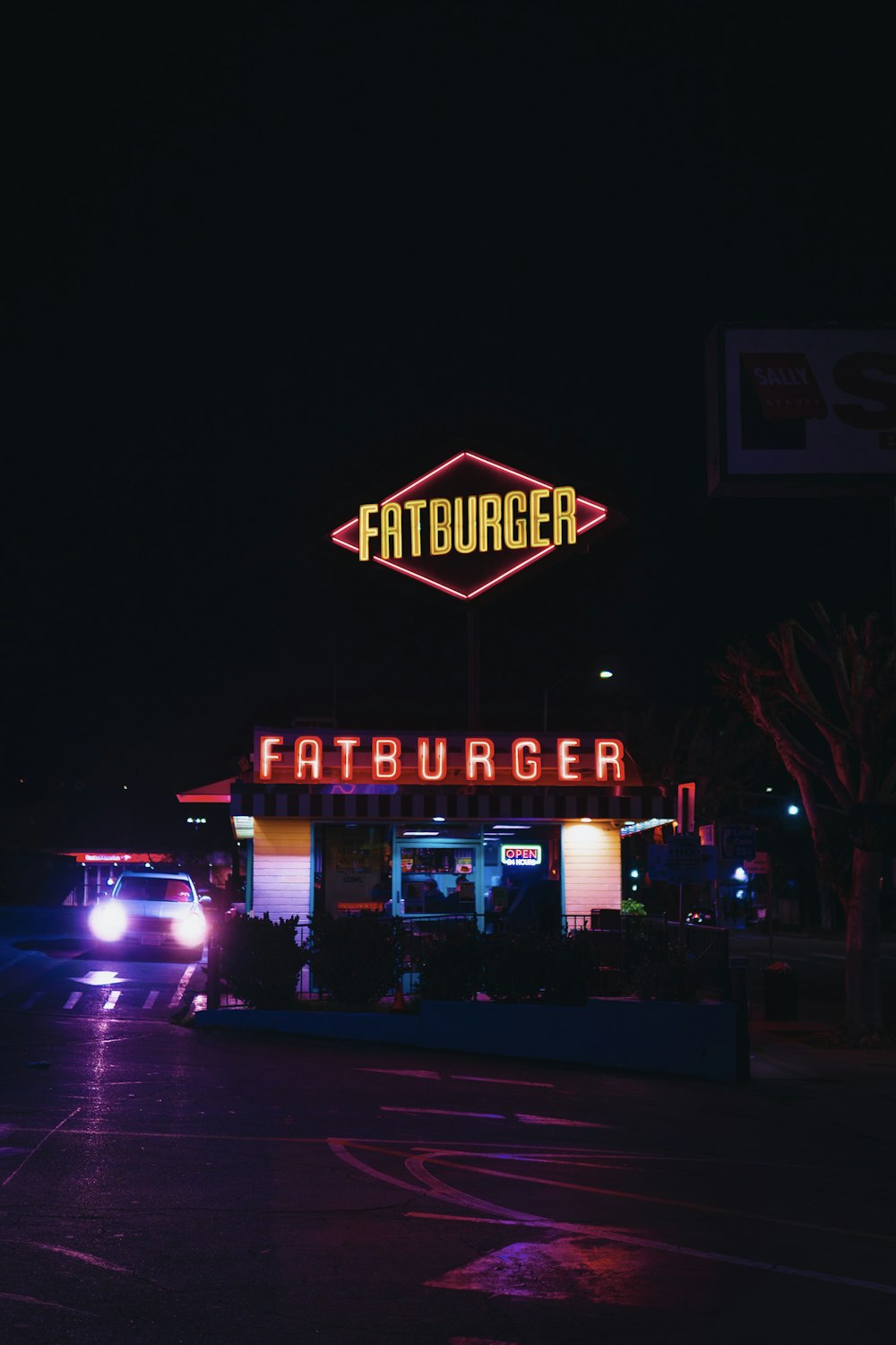 car parked near Fatburger restaurant