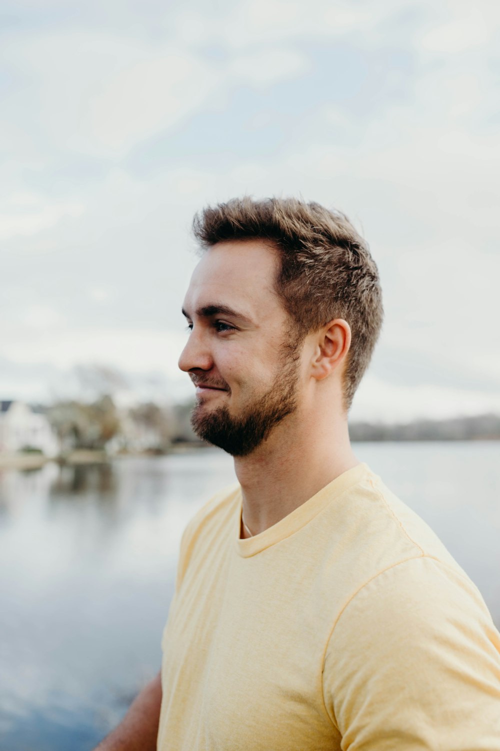 man wearing yellow crew-neck shirt