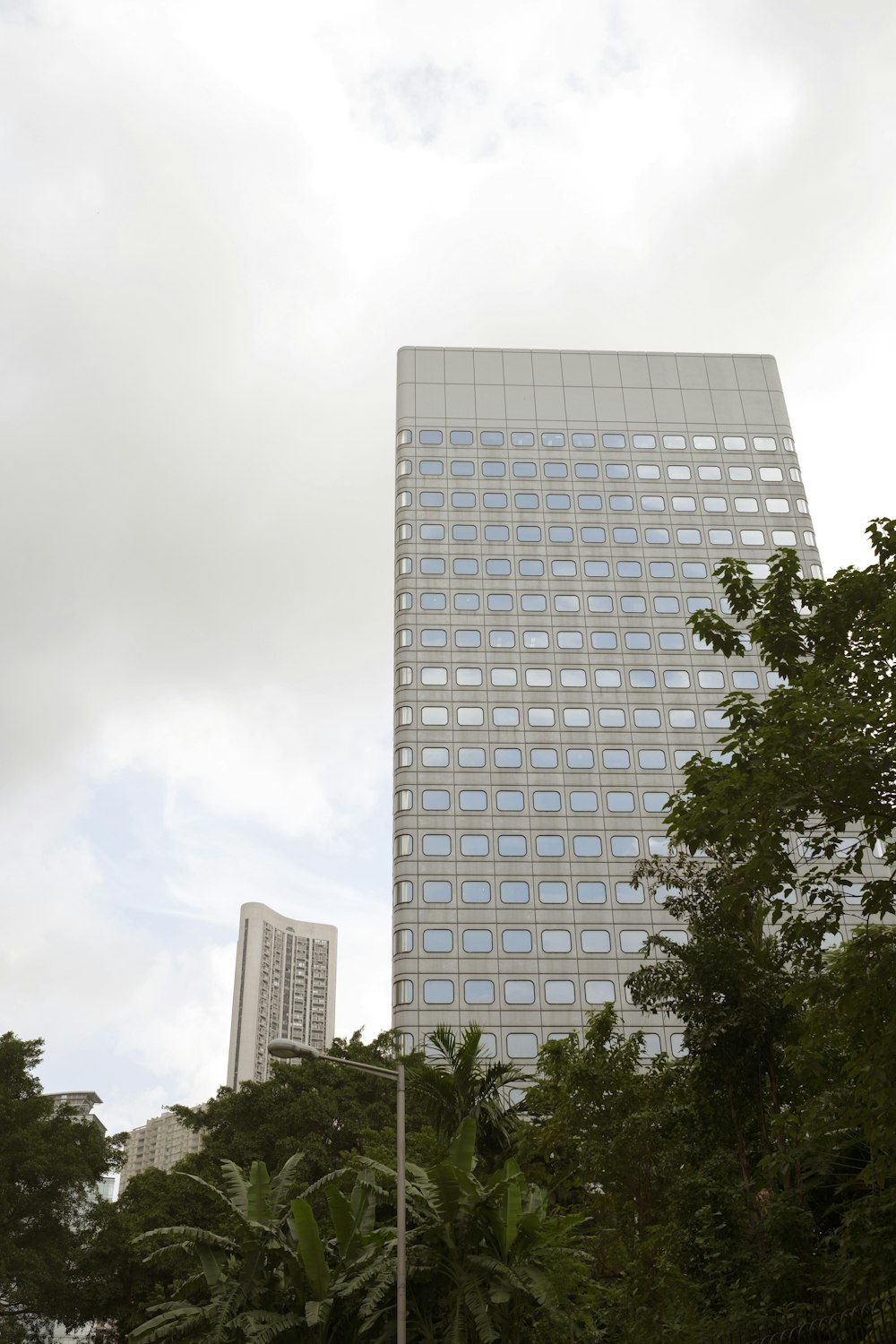 low angle photo of white high rise building