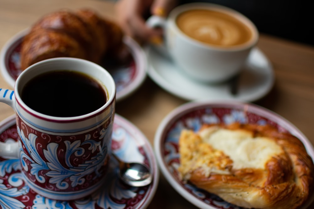 black coffee near baked bread