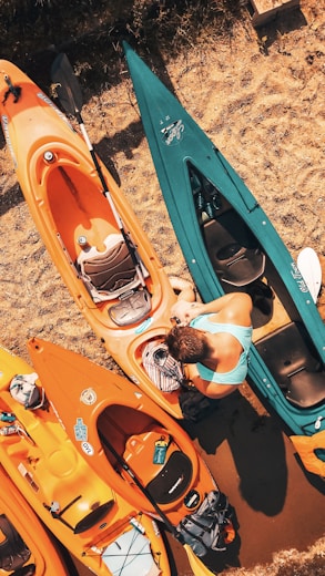 man standing on kayak