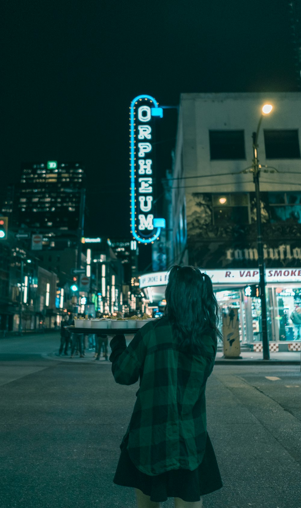 person walking in front storefront