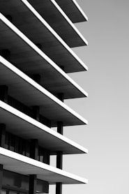 greyscale photo of high rise building