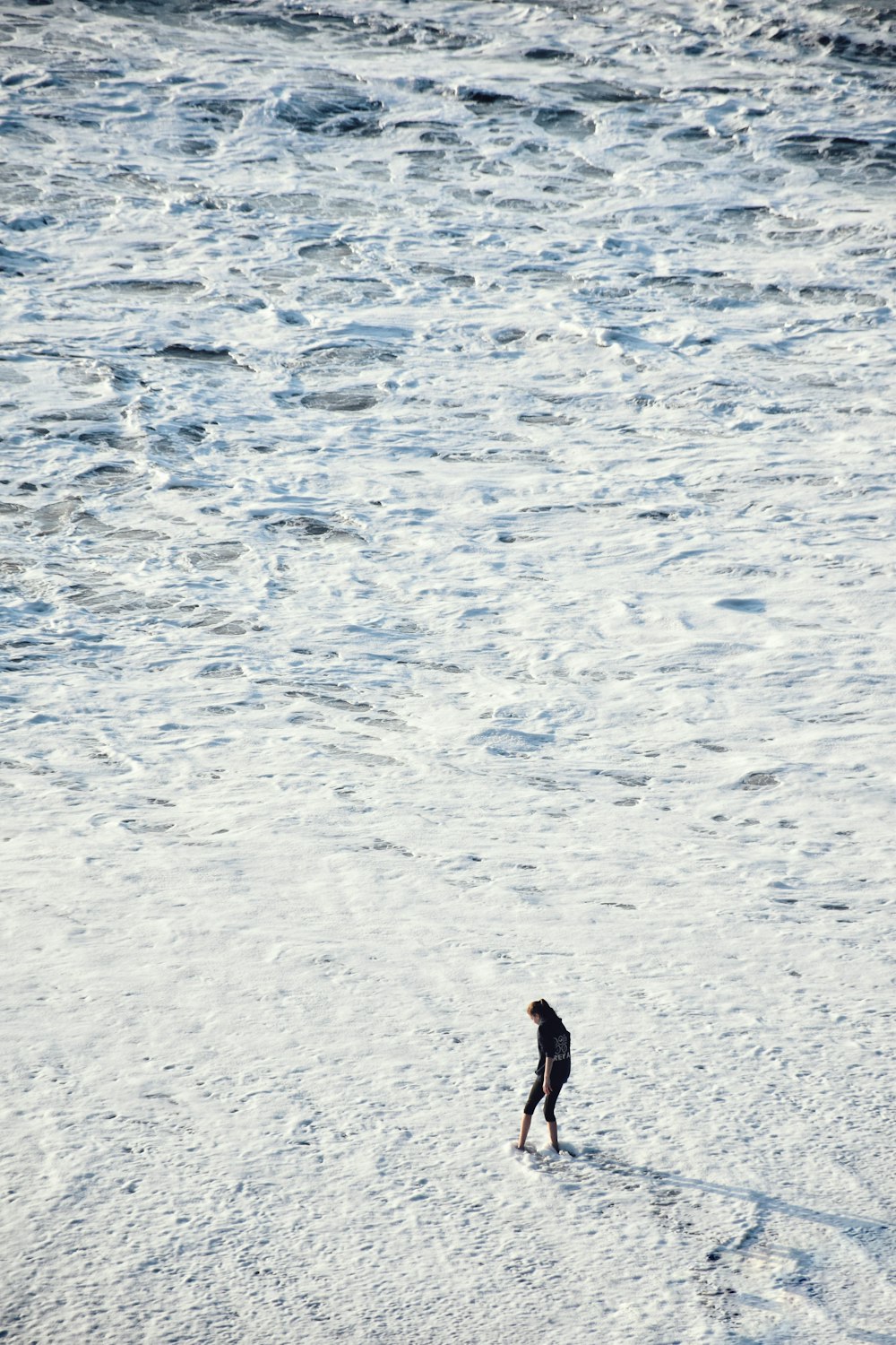person walking on icy surface