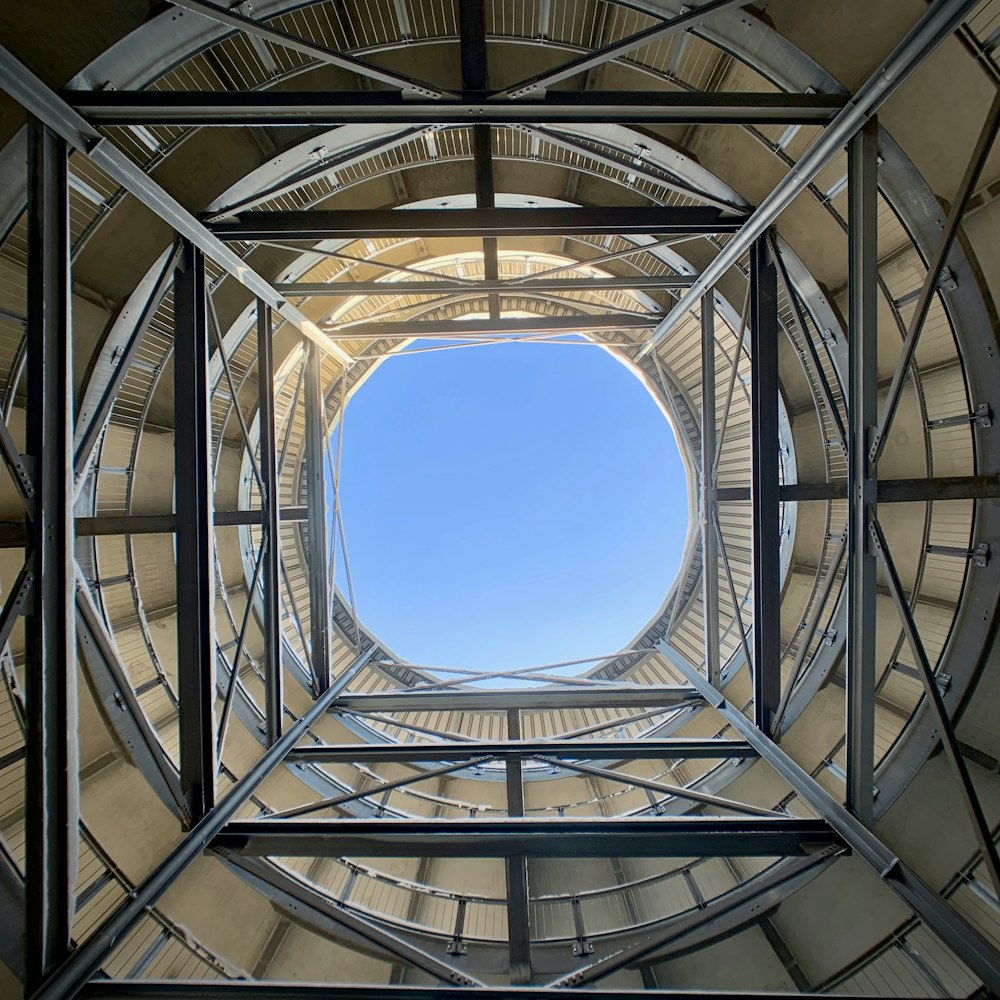 low-angle photography of metal scaffolding inside building