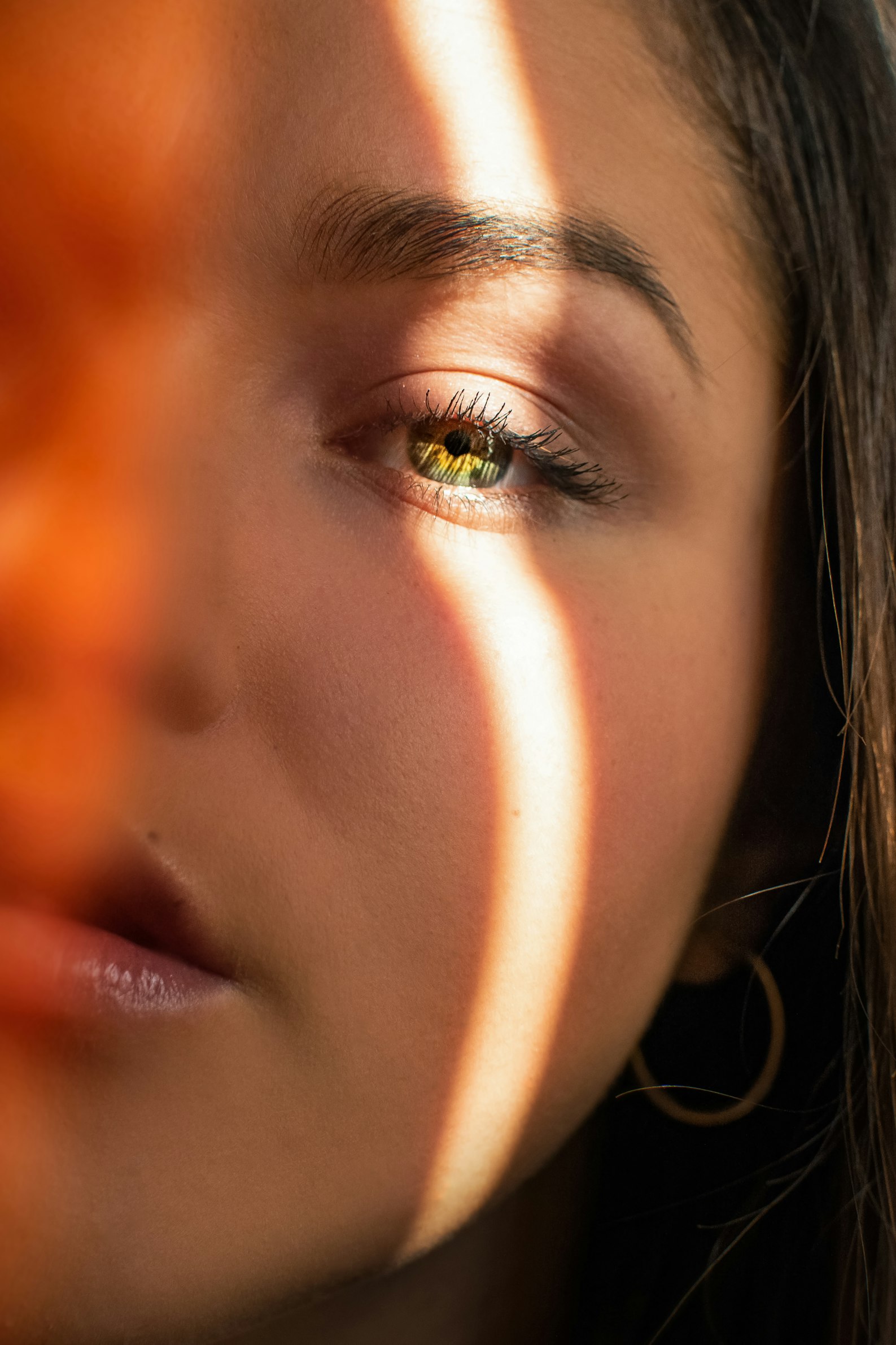 A woman with her face in the sunlight.