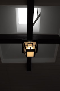 A modern light fixture elegantly installed in a kitchen ceiling.
