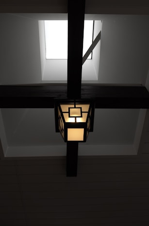A modern light fixture elegantly installed in a kitchen ceiling.
