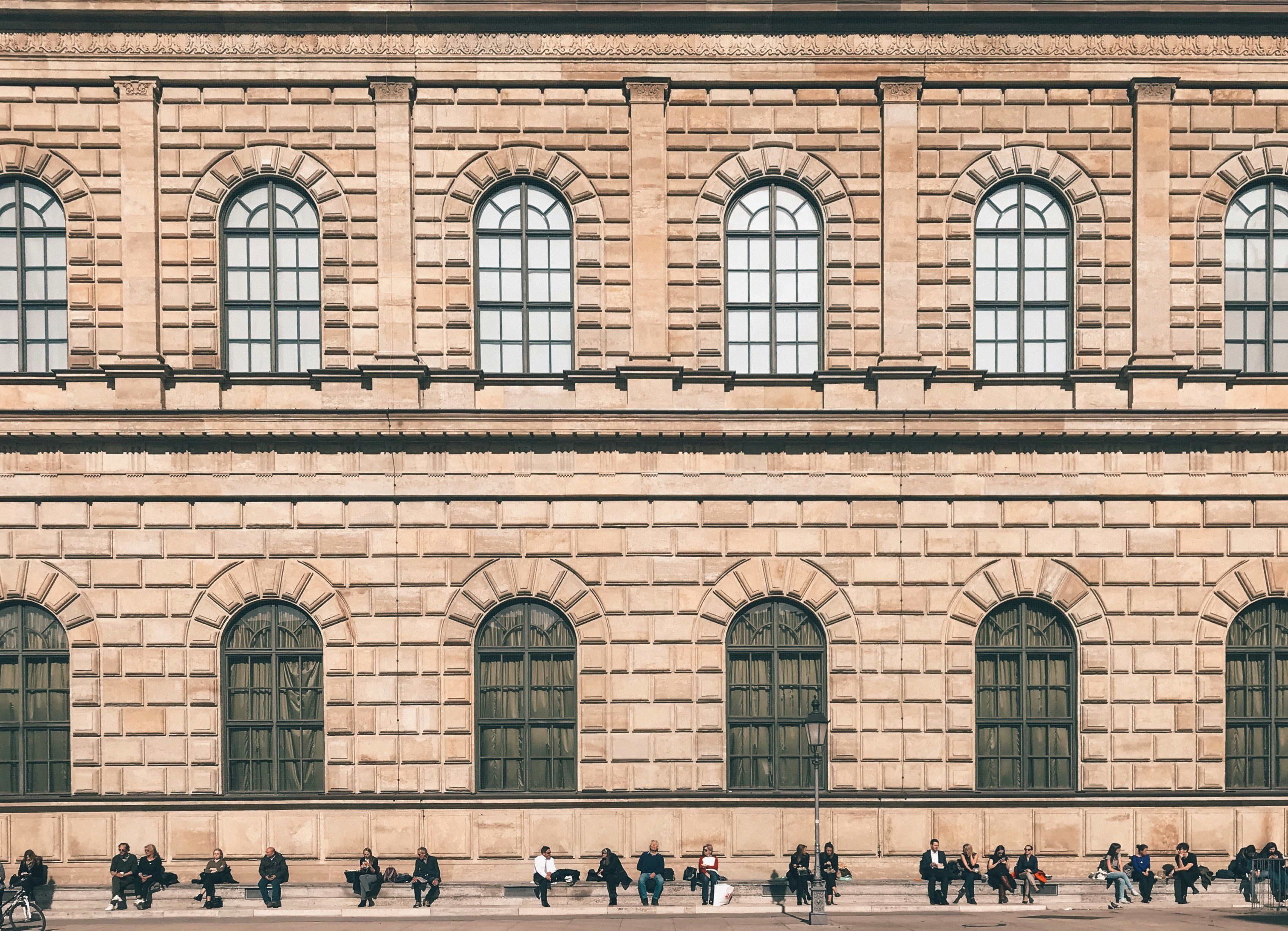 A conceptual drawing showing a modern library facade blended with an old historical building