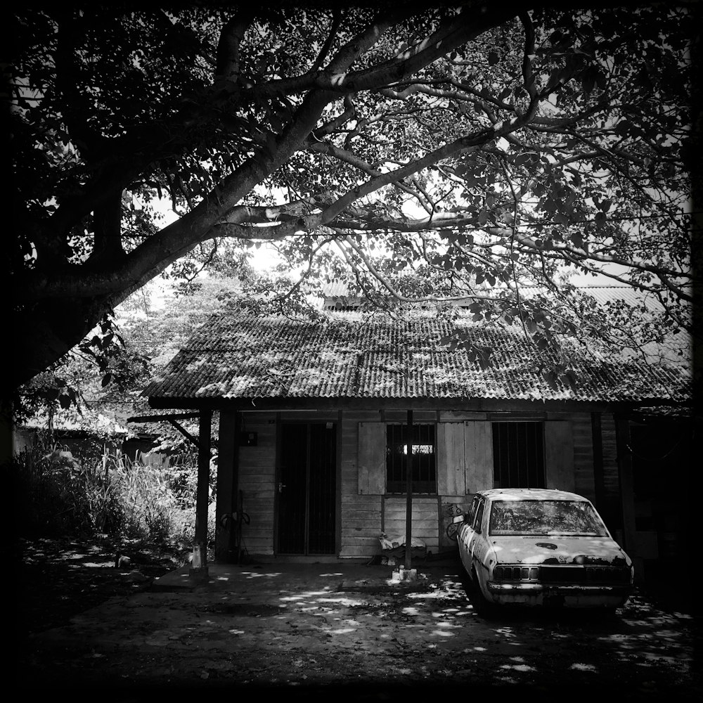 parked car beside house