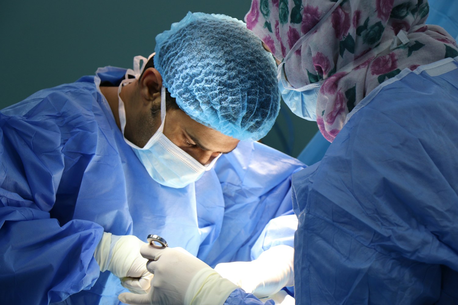 medical personnel doing operation in operating room