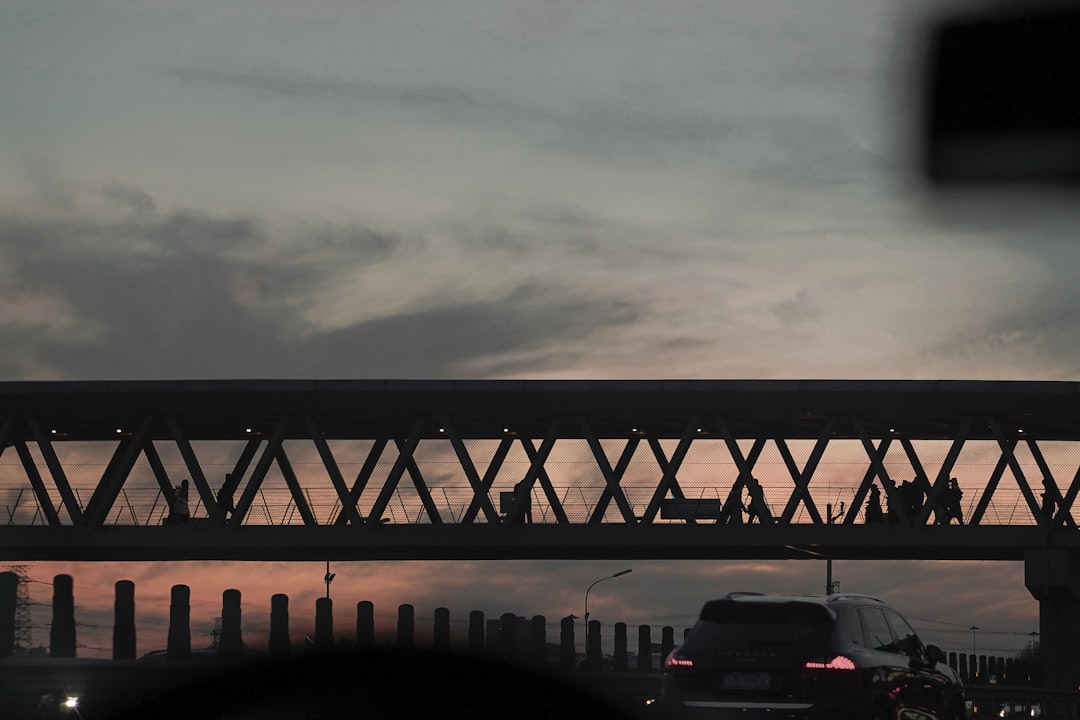 black suv on road under overpass