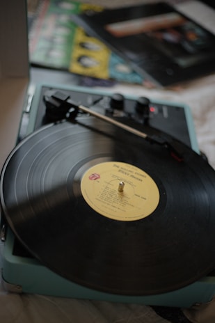 A vintage vinyl record player spinning a classic progressive rock album.