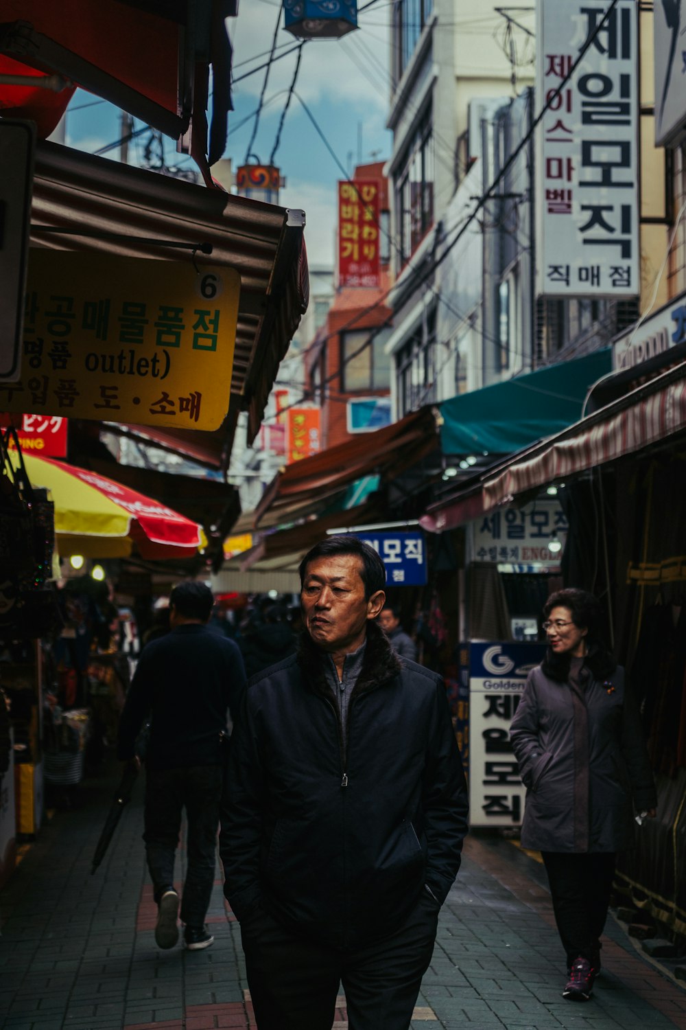 people walking on market during daytime