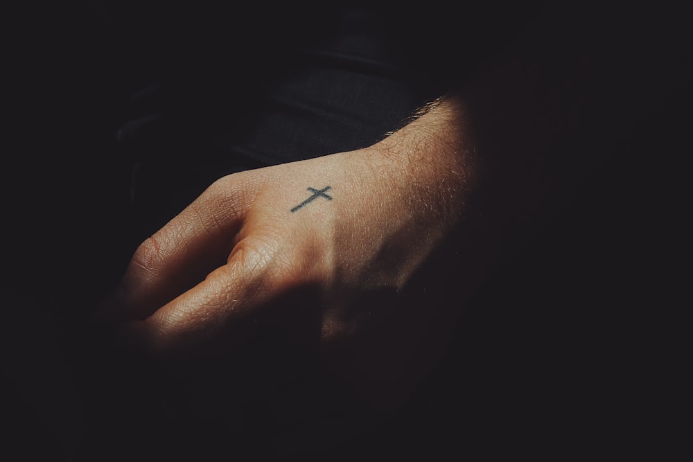 black ink cross arm tattoo