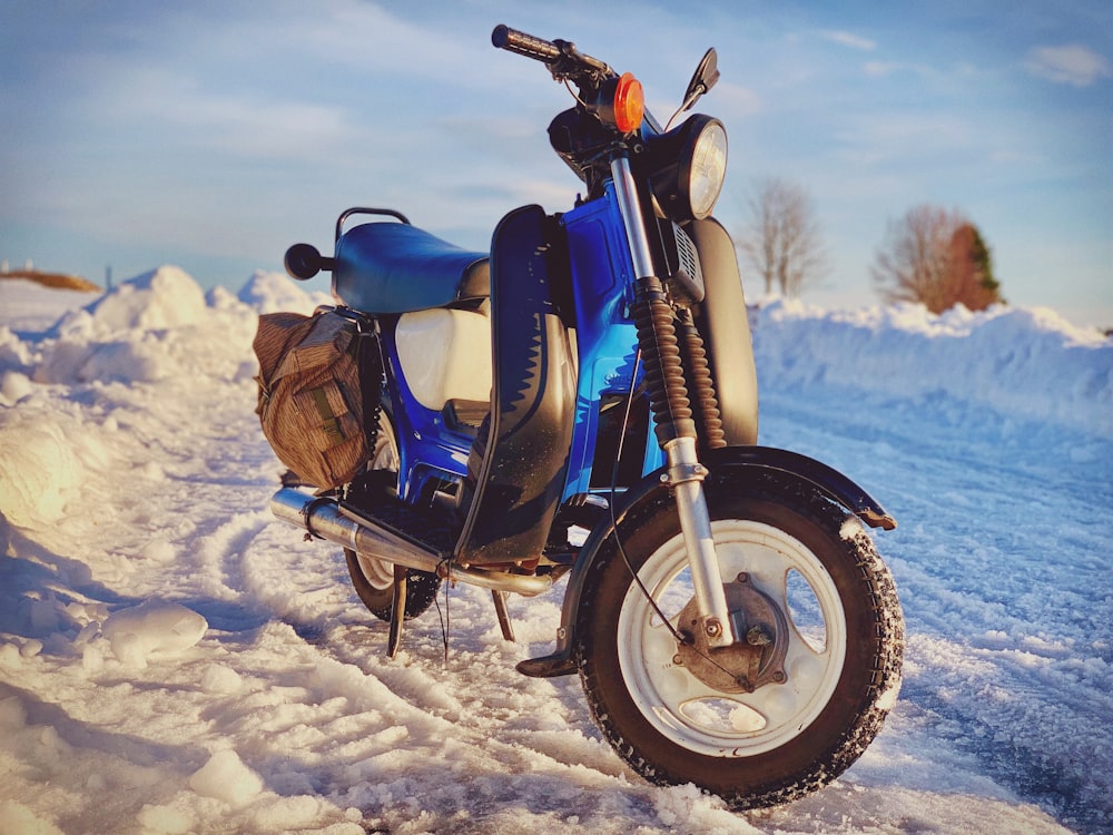 blue and white motor scooter