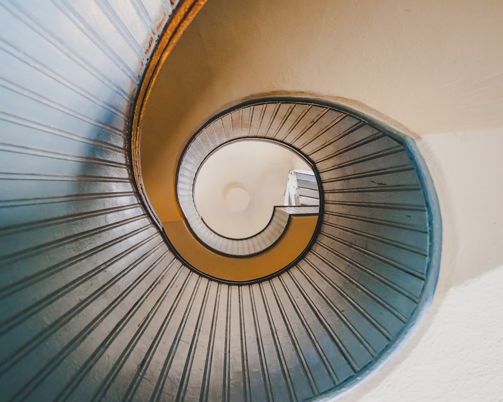 low angle photography of spiral ladder