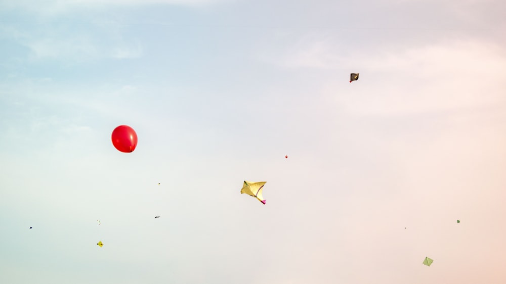 red balloon and yellow kite