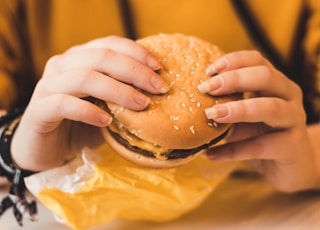 person holding hamburger