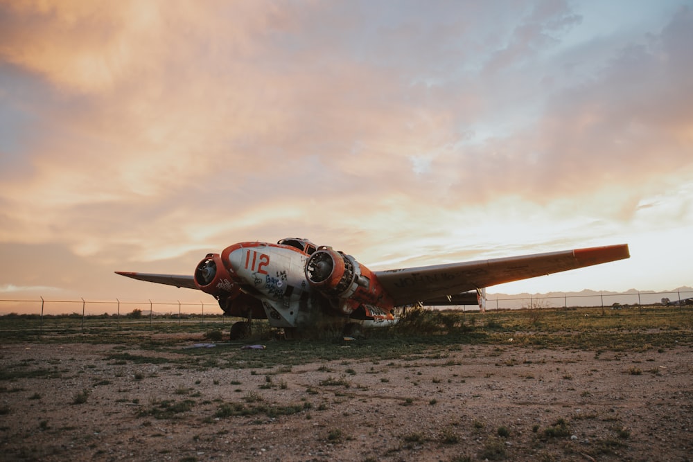 gray and orange propeller plane