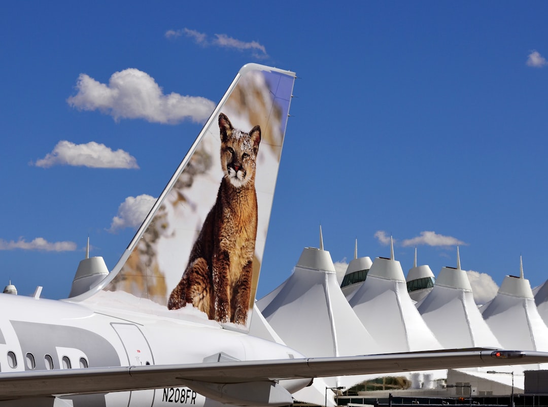 white airplane on park, I made a 3 day stop at Denver during a long “US Road Trip”.<p></figure>I drove from Yellowstone to work with Frontier Airlines.</p><p>In particular I wanted to photograph as much of their fleet as possible for the Nature Pics. on the tails of the aircraft.</p><p>This Pic. was during an escorted Airside/Ramp session.</p><p>Taken early August 2011.