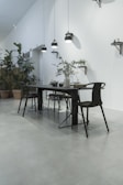 A modern dining area with a sleek dining table and chairs.