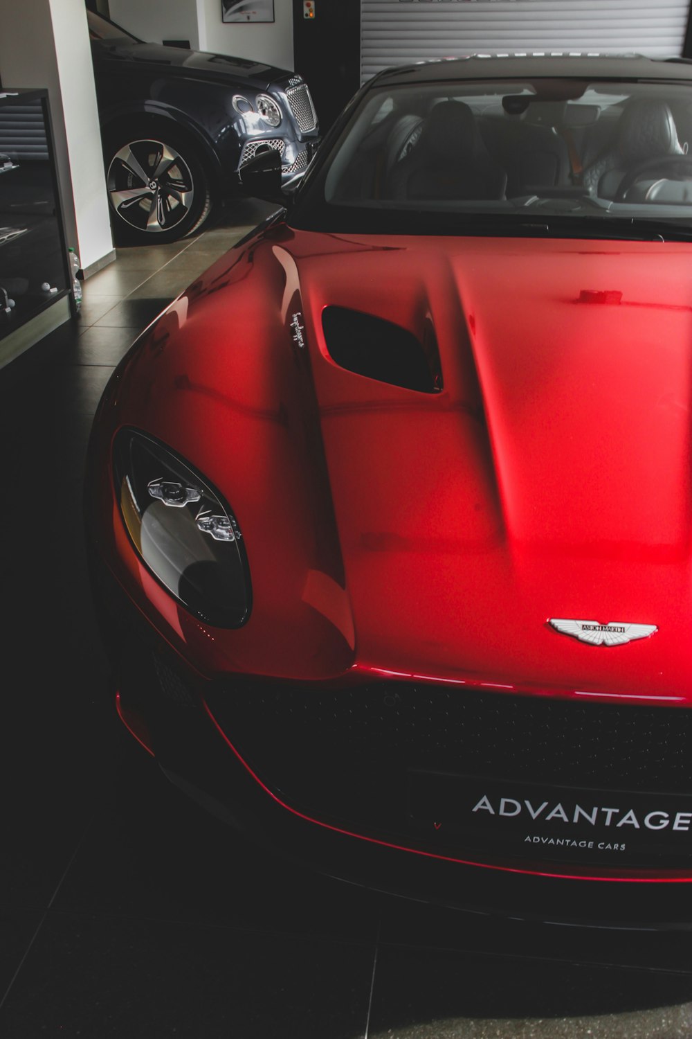 red sports car showing hood