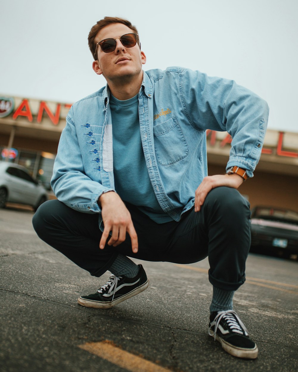 man wearing blue dress shirt