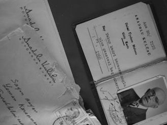 Close-up of hands holding a Medicare Supplement card and documents.