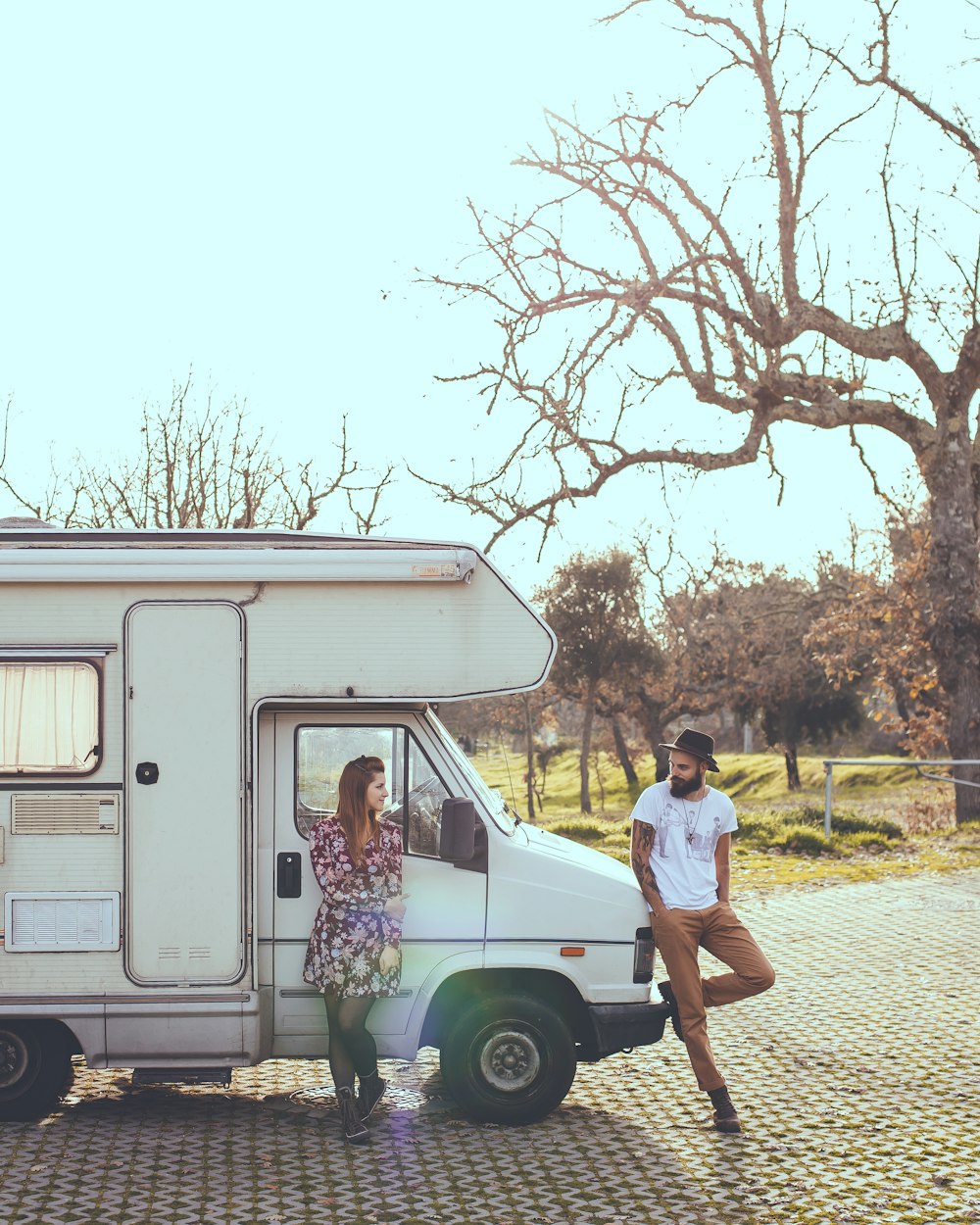 man and woman lying on truck